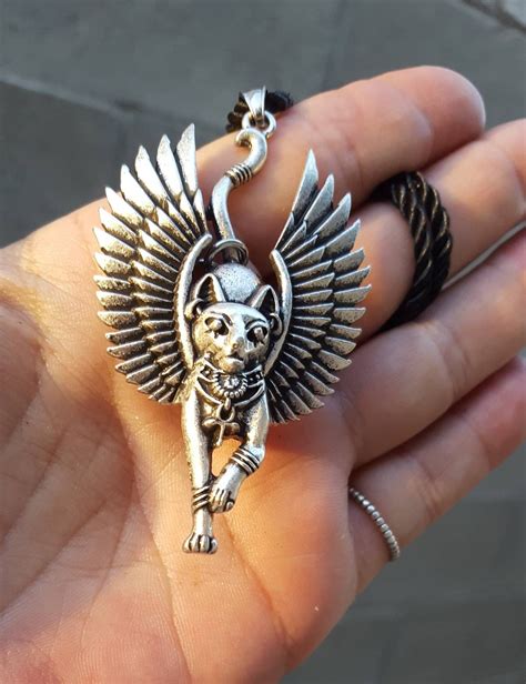 The Intimidated Feline Amulet Pendant: A Token of Success and Prosperity.